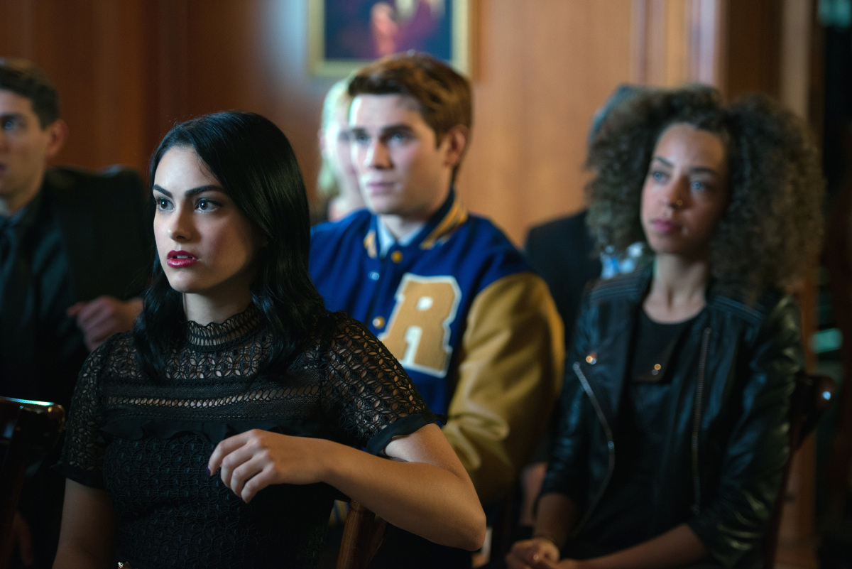 Riverdale -- "Chapter Five: Heart of Darkness" -- Image Number: RVD105b_0330.jpg -- Pictured (L-R): Camila Mendes as Veronica Lodge, KJ Apa as Archie Andrews, and Hayley Law as Valerie -- Photo: Diyah Pera /The CW -- ÃÂ© 2017 The CW Network. All Rights Reserved
